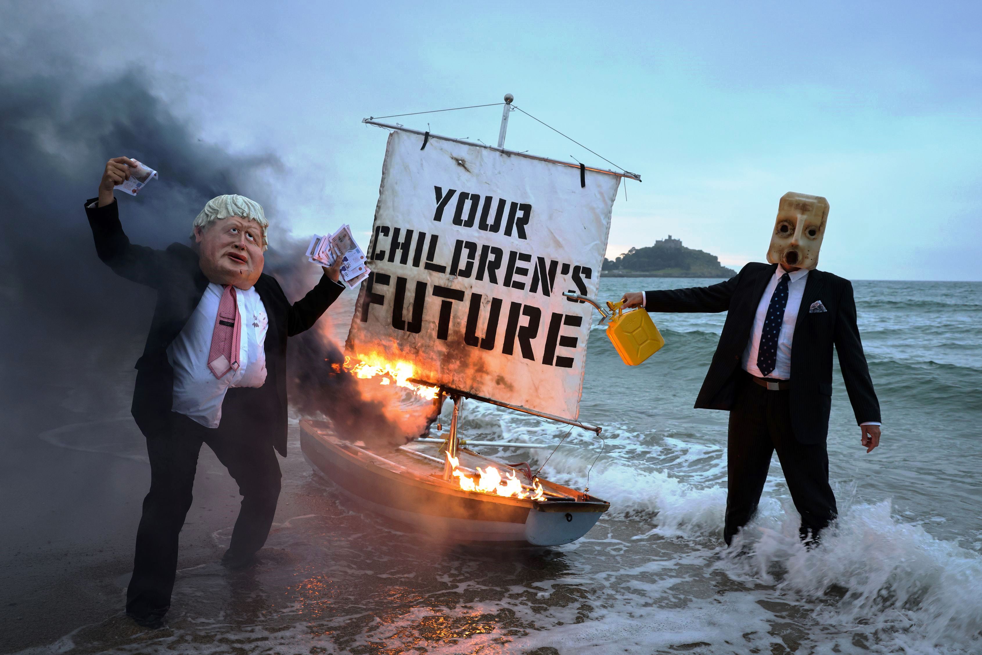 G7 Boris burns boat on beach - enlarge